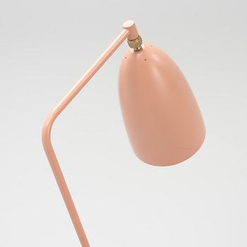 A 'Grasshopper' floorlamp by Greta Magnusson Grossman for Gubi.