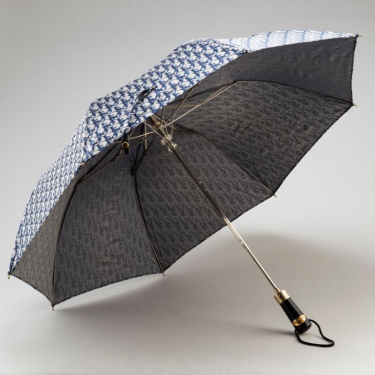 CHRISTIAN DIOR, a set of a clutch, a belt and an umbrella.