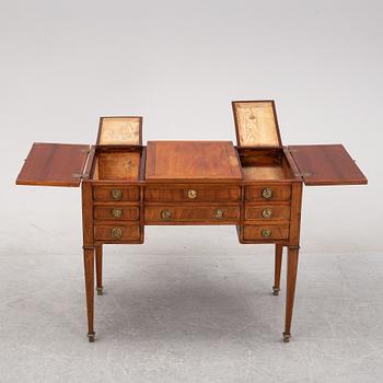 A mahogany toilet table, Louis XVI-style, late 19th century.