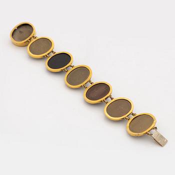 Gold and lava cameo bracelet.