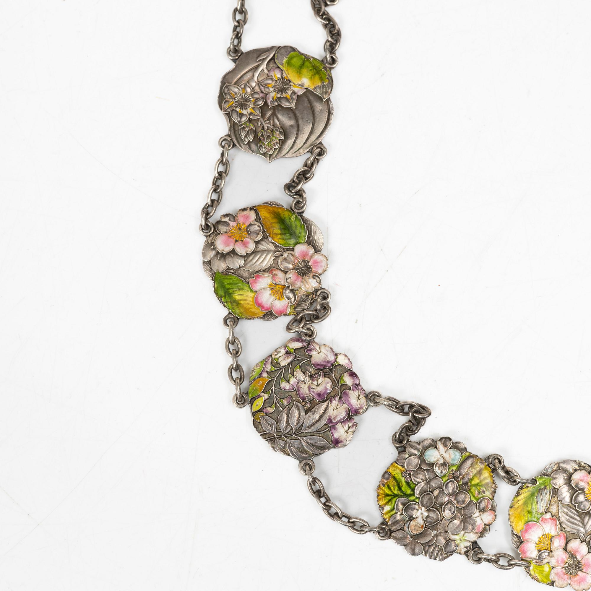 A Japanese Art Nouveau silver and enamel floral belt, by Sanju Saku, Meiji period (1868-1912).