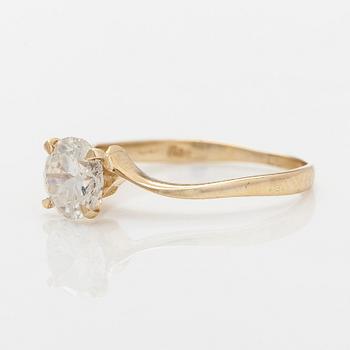 A 14K gold ring with brilliant cut diamond.