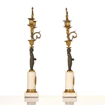 A pair of late Gustavian white marble and bronze candelabra.