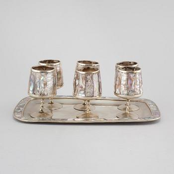 Six liqeur glasses on a tray, mother of pearl and alpaca, Mexico, second half of the 20th century.