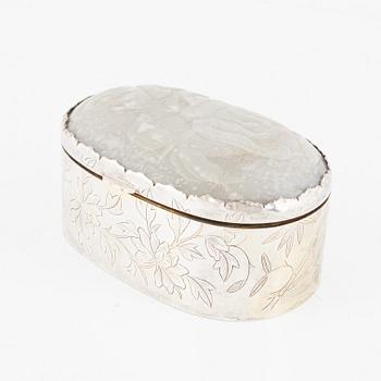 A silver box, the cover set with an inlaid Chinese nephrite relief, 20th century.