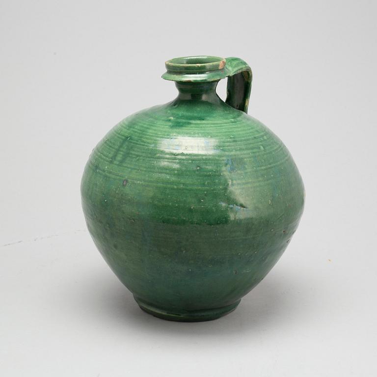 A green glazed ceramic bottle/jar, late Ming dynasty.