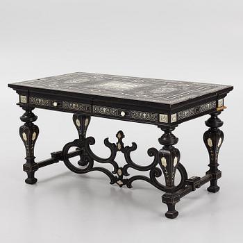 A Renaissance-style ebony, ebonized and ivory-inlaid library table, late 19th century, presumably Germany.