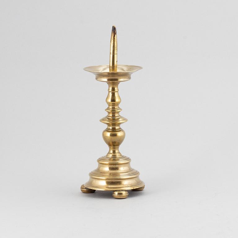 A 16th century bronze candlestick.