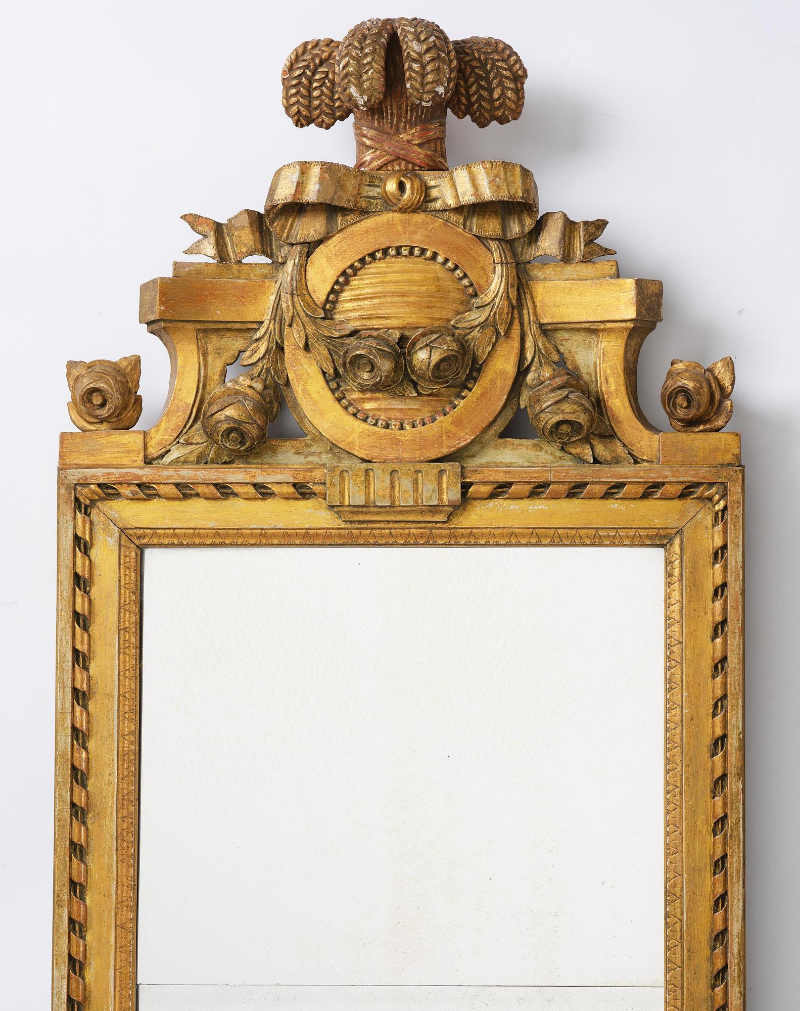 A Gustavian giltwood mirror by C. G. Fyrwald (master in Stockholm 1776-1825).