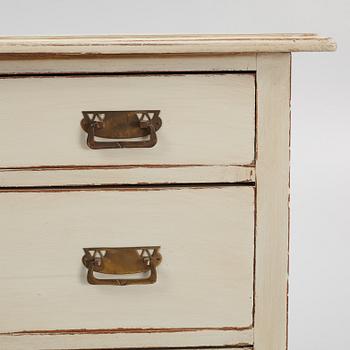 A chest of drawers, circa 1900.