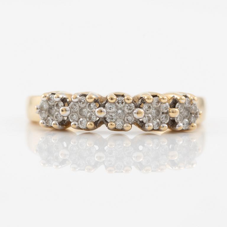 Ring in 18K gold set with small brilliant-cut diamonds.