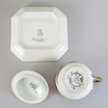A set of seven Royal Copenhagen 'Flora Danica' custard cups with stands, 20th Century.