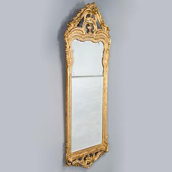 Johan Åkerblad, a giltwood Rococo mirror, signed and dated in Stockholm 1776.
