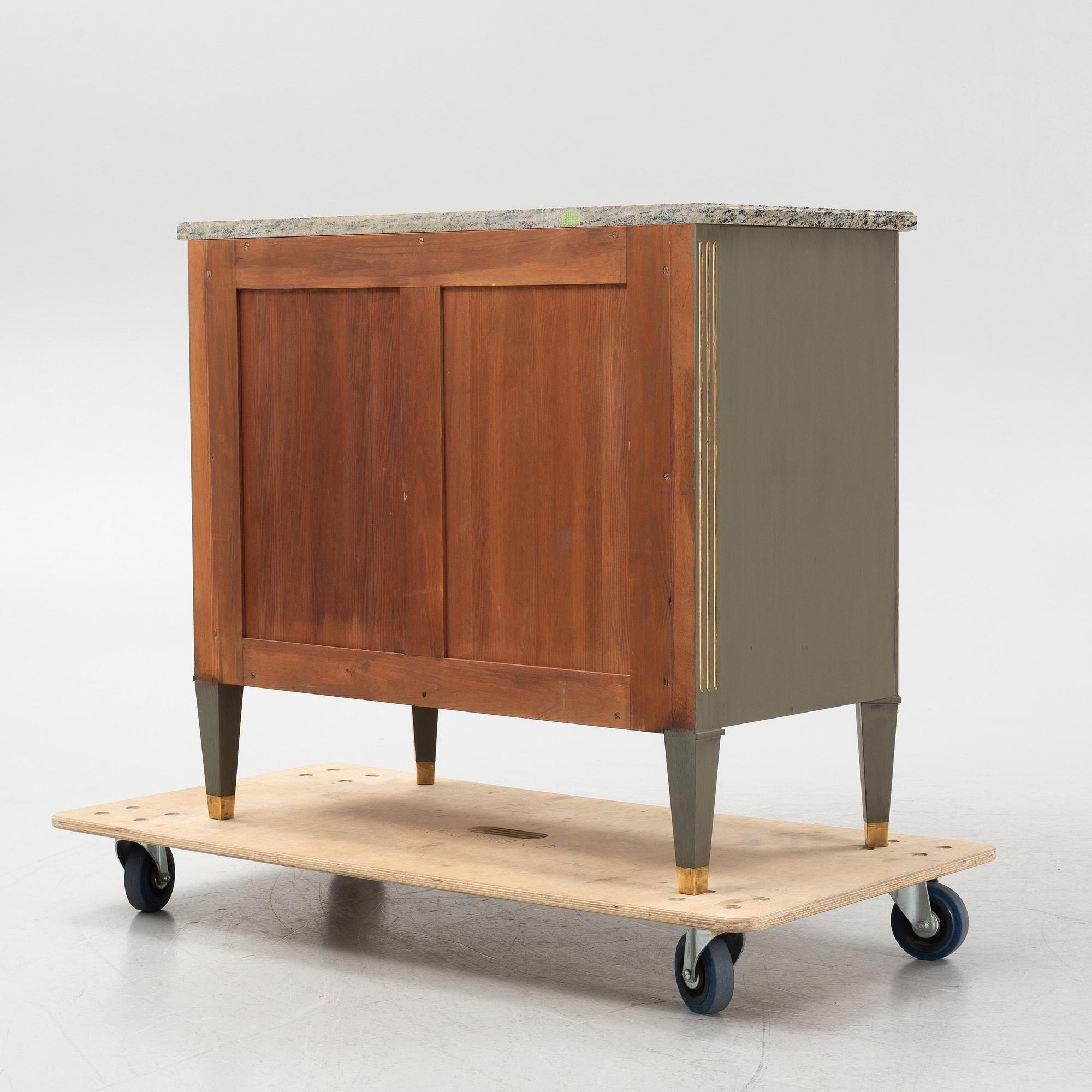 A painted Gustavians style chest of drawers with stone top, first part of the 20th Century.