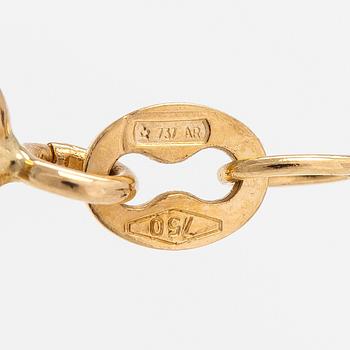 An 18K gold necklace with a heart shaped pendnat with diamonds ca. 0.09 ct in total.