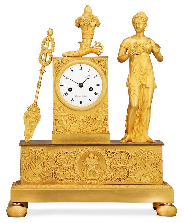 A French Empire gilt bronze mantel clock by Flocard.