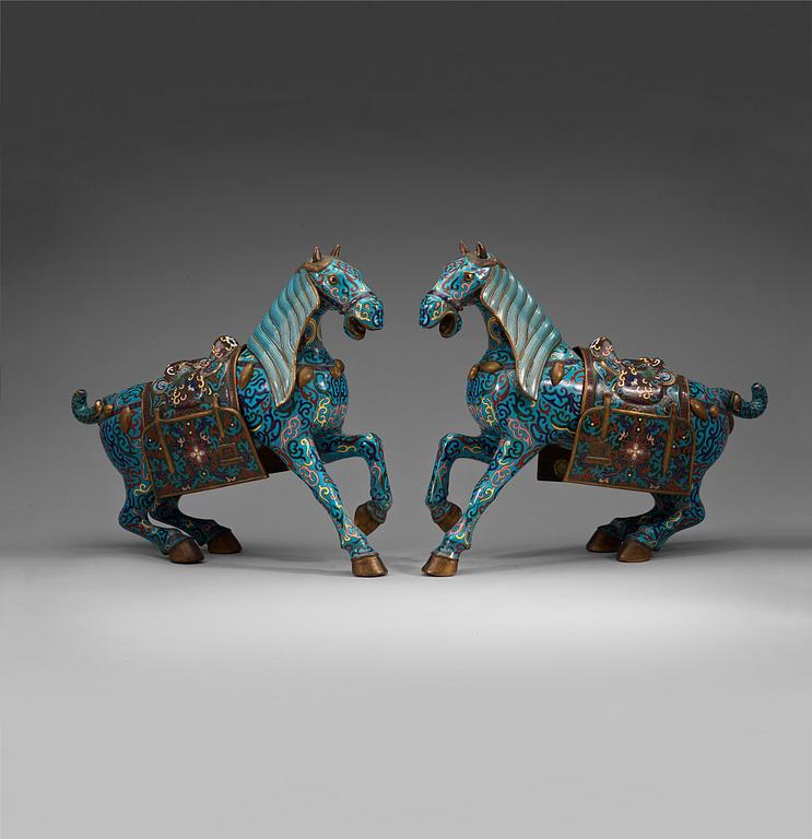 A pair of Chinese cloisonné figures of horses, presumably early 20th Century.