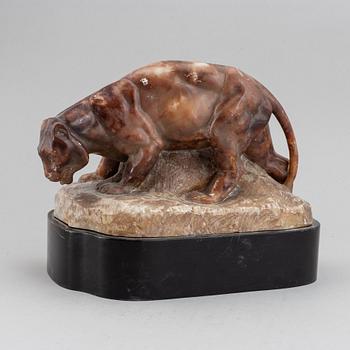 A 20th century stone sculpture of a panther.