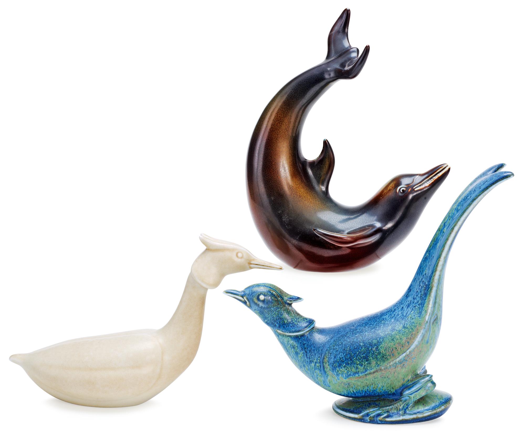 Three Gunnar Nylund stoneware figures, a dolphin, a pheasant and a great crested grebe, Rörstrand.