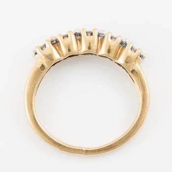 Ring in 18K gold set with small brilliant-cut diamonds.