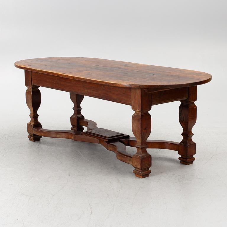 An oak dining table, Baroque early 18th century and Baroque style 19th/20th century.
