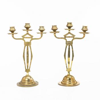 Jugend/Art Nouveau, A pair of brass candelabra, early 20th century.