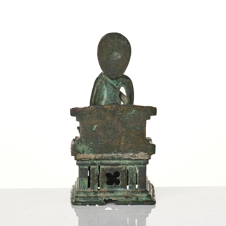 A bronze Buddha Vairocana, Eastern Java, 10th century.