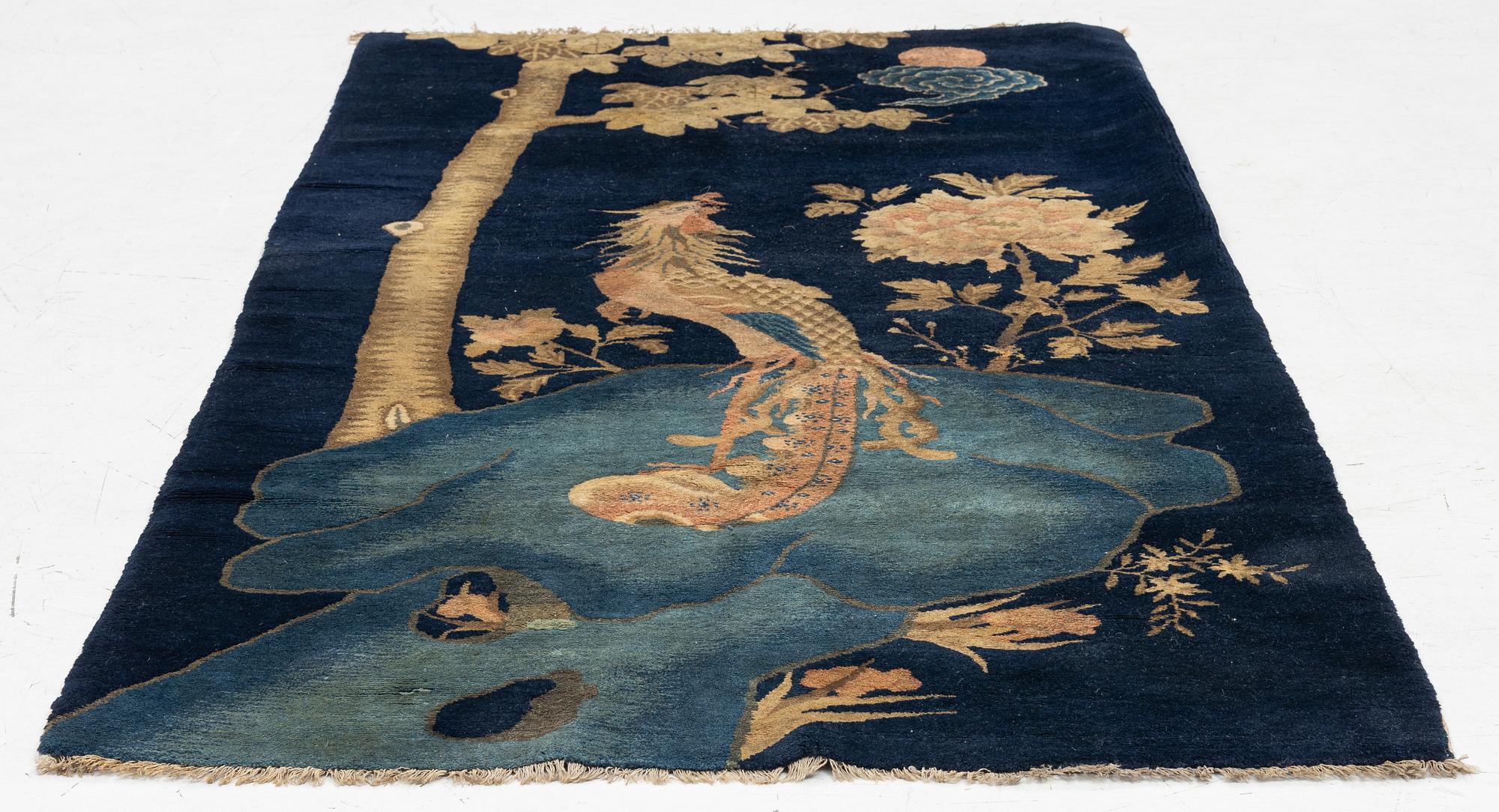 A Chinese ’phoenix rug’, 20th century, c. 181 x 93 cm.