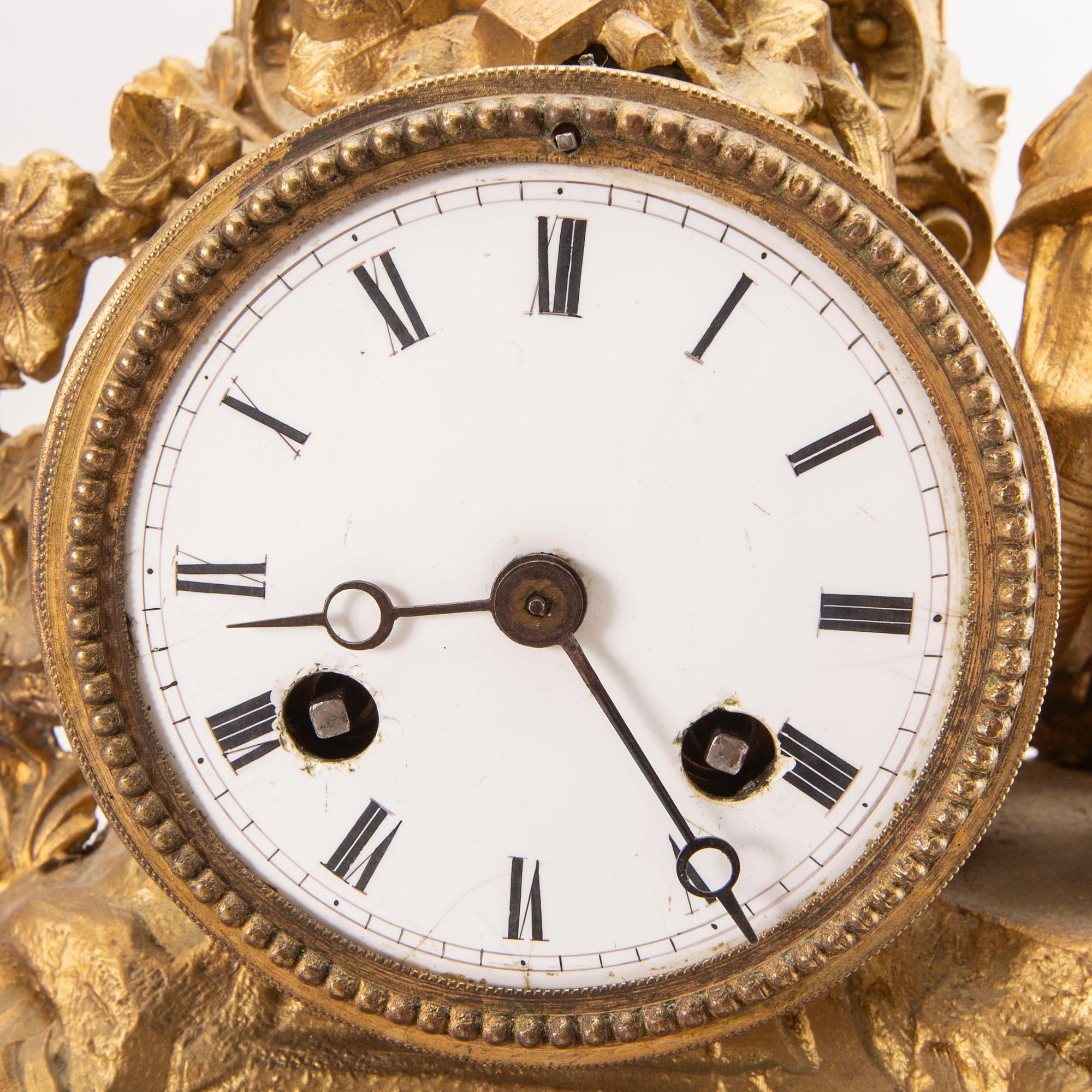 A Neo Rococo bronzed table clock.