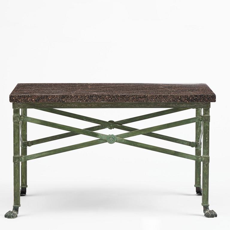 A table with Swedish 'Orrlok' porhyry top, early 19th century on a later bronze stand.