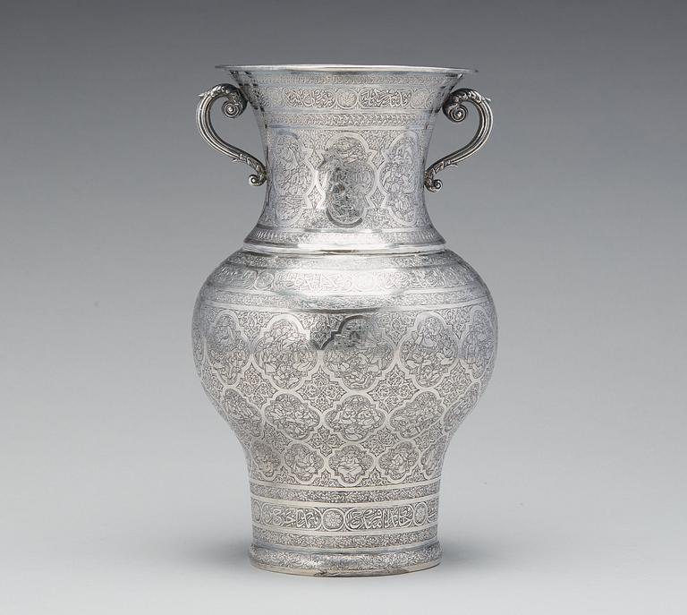 A  persian silver two handled vase from the late Qajardynasty.