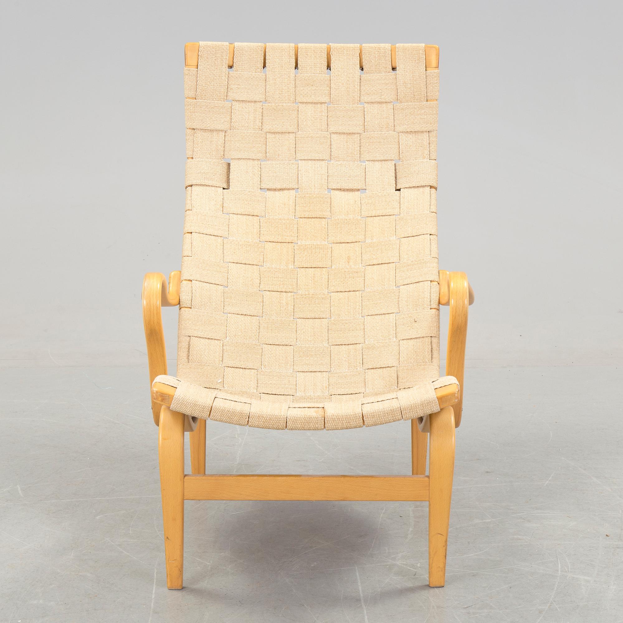 A BRUNO MATHSSON "PERNILLA 2, T. 107" BEECH AND WEBBING ARMCHAIR, Firma Karl Mathsson, Värnamo, Sweden, 1981.
