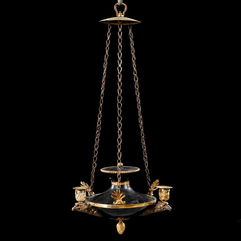 An empire three-branch chandelier, made in the first half of the 19th century.