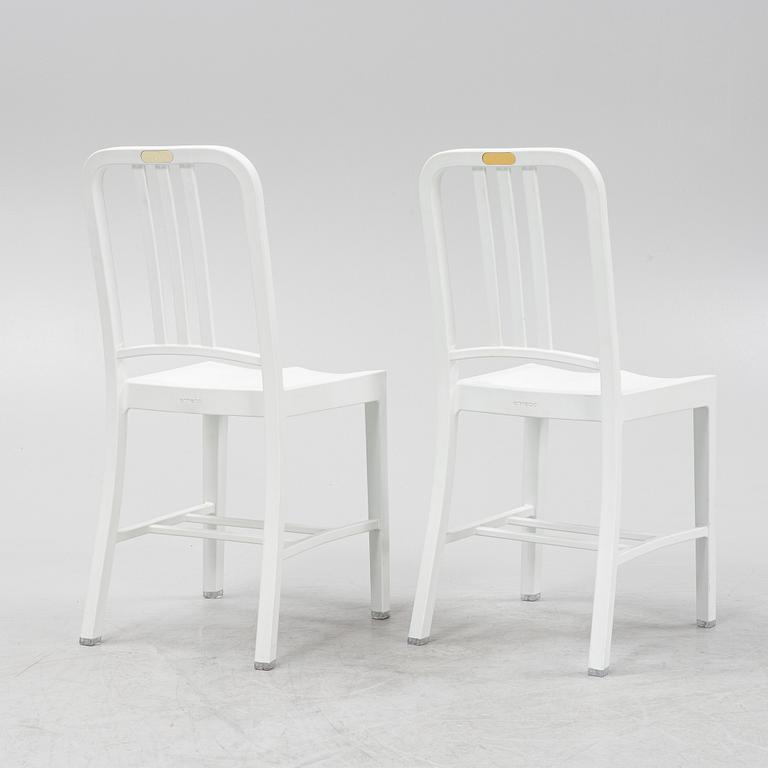 A pair of plastic 'Navy Chair' by Emeco.