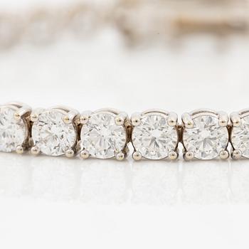 A tennis bracelet in 18K white gold set with round brilliant-cut diamonds total ca 11.50 ct, accompanied by GIA dossier.