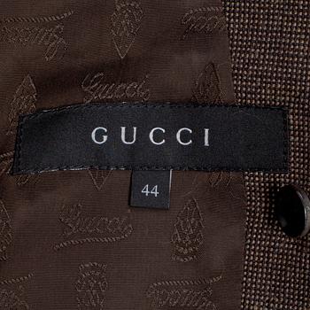 GUCCI, a two-piece suit consisting of jacket and pants.