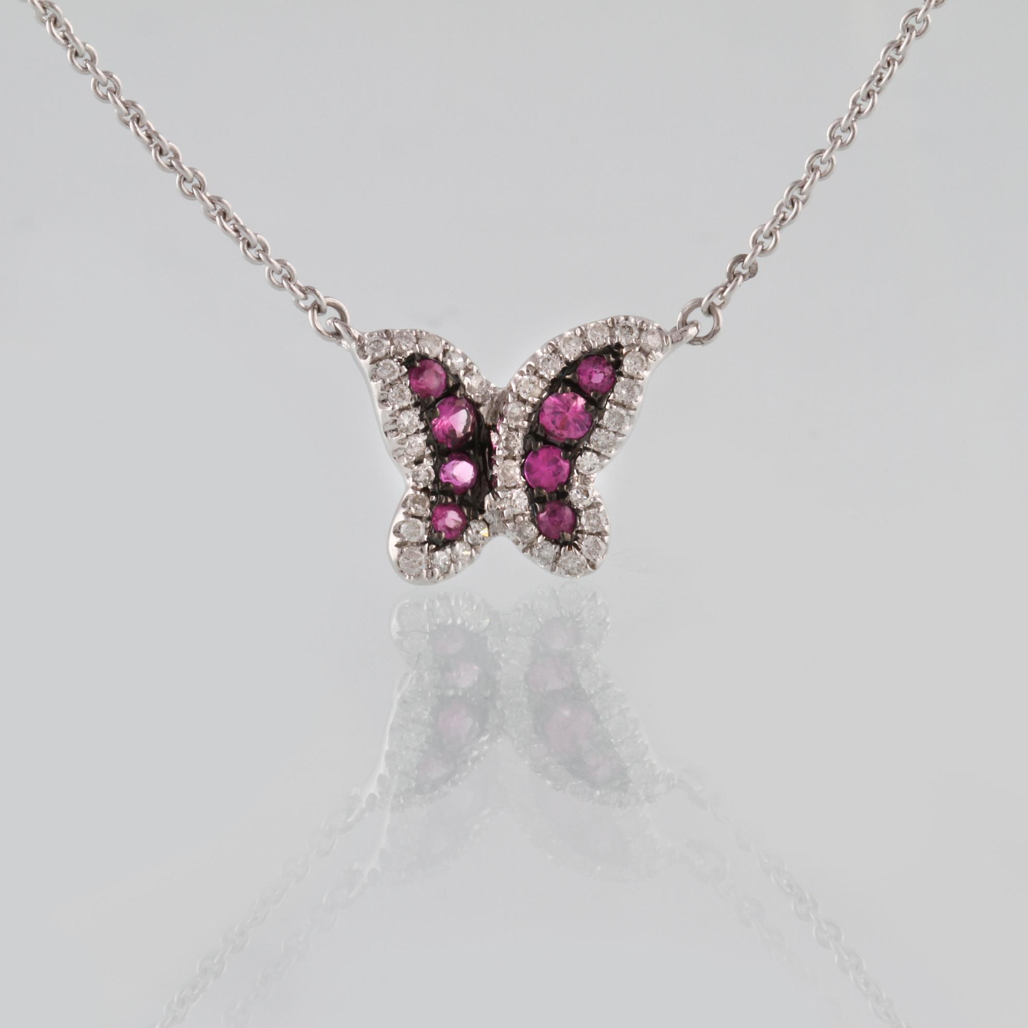 COLLIER, 18K vitguld med briljantslipade diamanter ca 0.14 ct samt fasettslipade rubiner ca 0.16 ct. Vikt 2,6 gram.