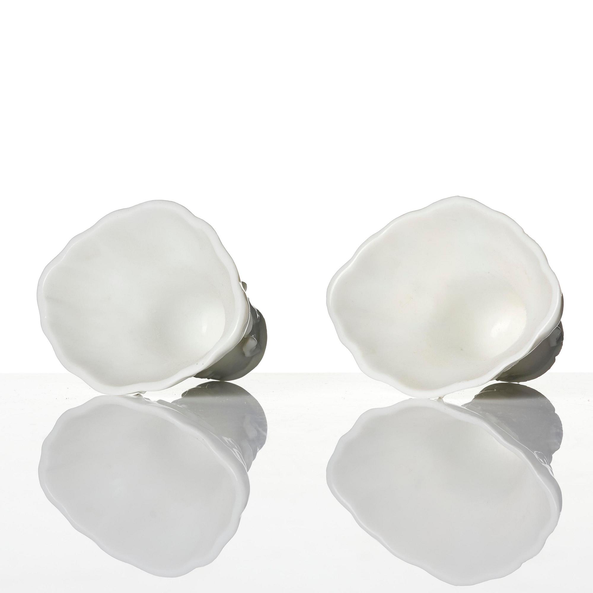 Two blanc de chine rhinoceros libation cups, Qing dynasty, Kangxi (1662-1722).