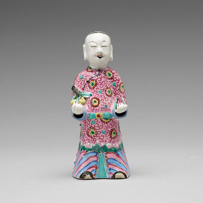 A famille rose figure of a laughing boy, Qing dynasty, circa 1800.