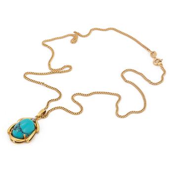 A 18K gold turquoise pendant.