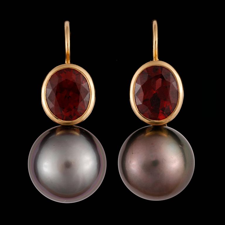 A pair of Tahiti pearl, 13 mm, and garnet earrings.