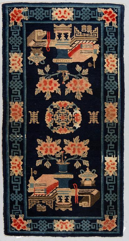 A rug, semi-antique Baotou, China, ca 135 x 70 cm.