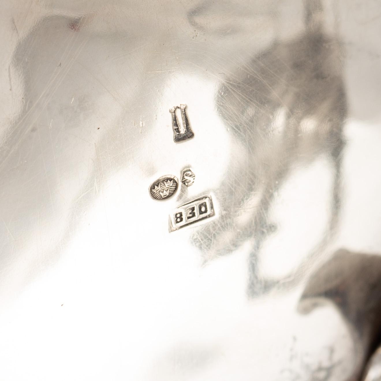 A Rococo-style silver coffee pot, creamer and sugar bowl, 20th Century.