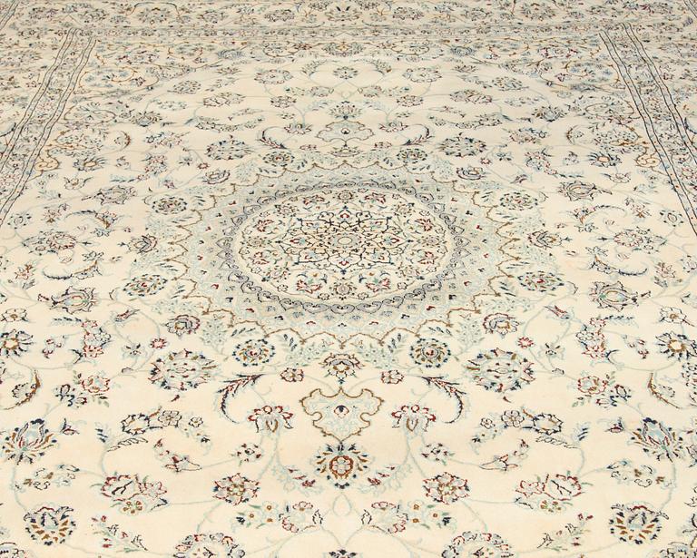 A carpet, Nain, part silk s.k 9LAA. Circa 376 x 249 cm.