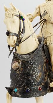 A late 19th century equestrian ivory, wood and metal statue.