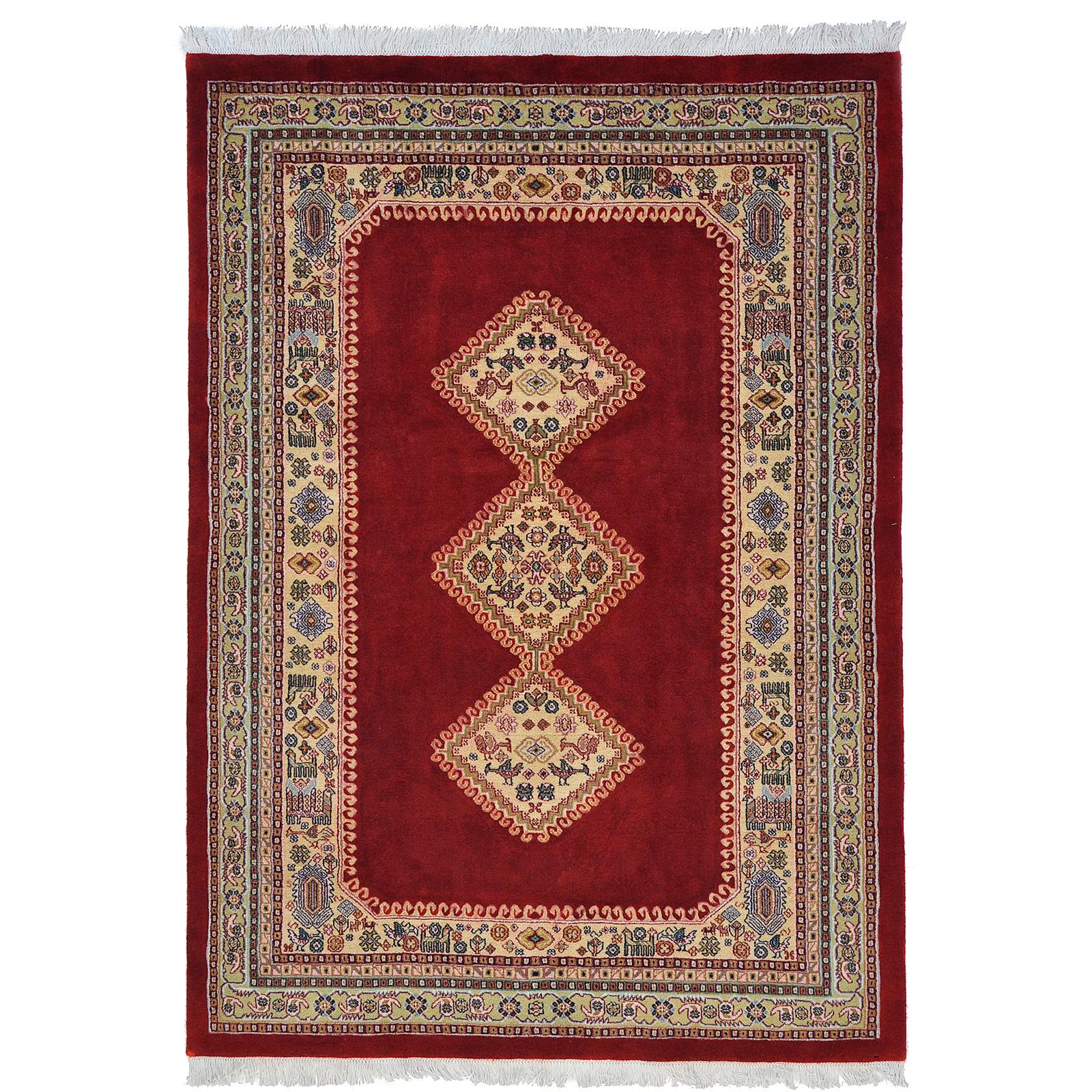 A Persian Rug, approximately 240 x 165 cm.