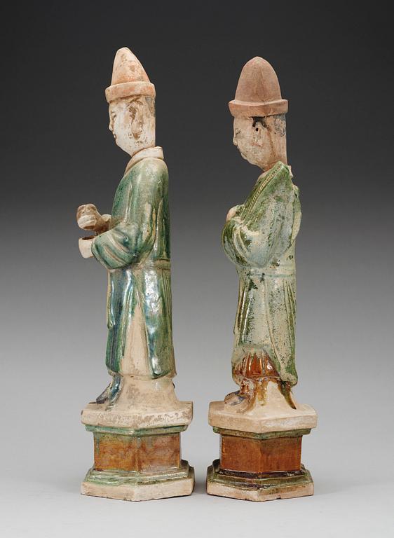 Two green and yellow glazed potted figures of Dignitaries, Ming dynasty.