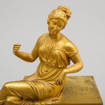 A first half of the 19th century Empire bronze mantle clock.