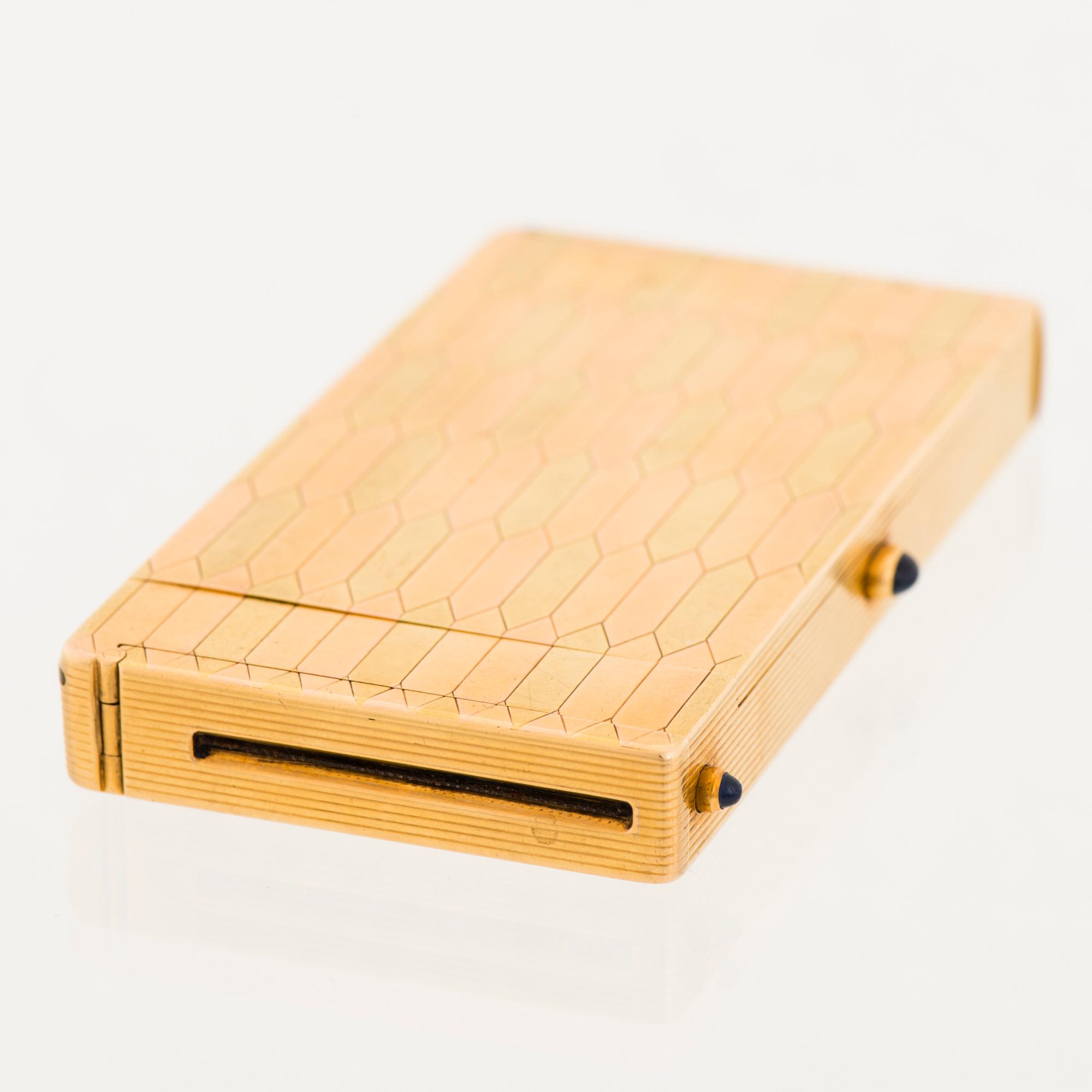 A CARTIER CASE, 18K gold in three colours, cabochon cut sapphires.