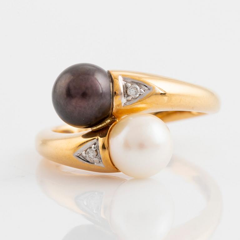 Gold and two cultured pearl and brilliant cut diamond cross over ring.